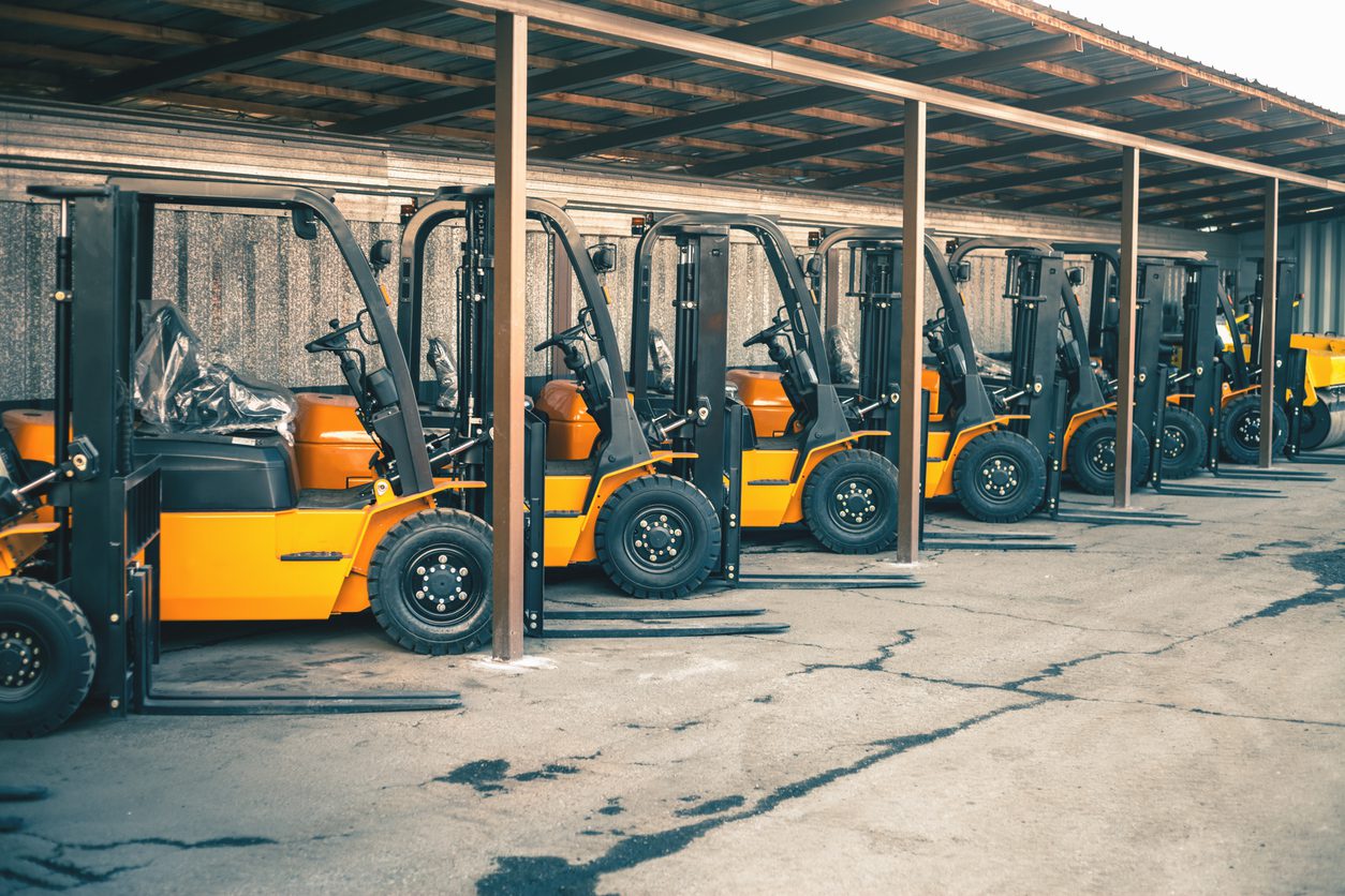 Background of a lot of forklifts, reliable heavy loader, truck. Heavy duty equipment, forklift